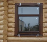 Memasang jendela di rumah kayu: harga kesalahan